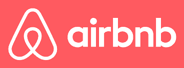 Airbnb logo on a red background